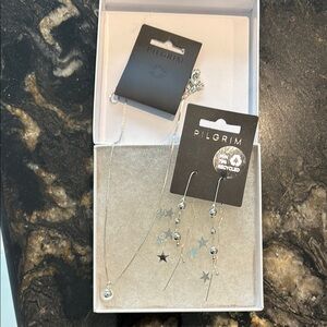 Pilgrim Elegant Silver Jewelry earrings and necklace set.